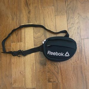 Pink and black Reebok Fanny pack, in good condition.